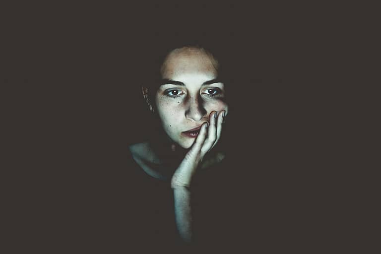 fatigued woman staring at screen